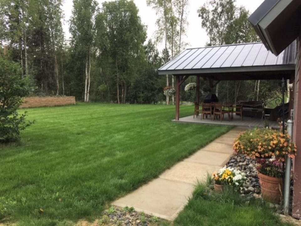 Front yard with covered deck.