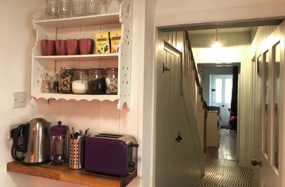 Toaster and kettle in kitchen.