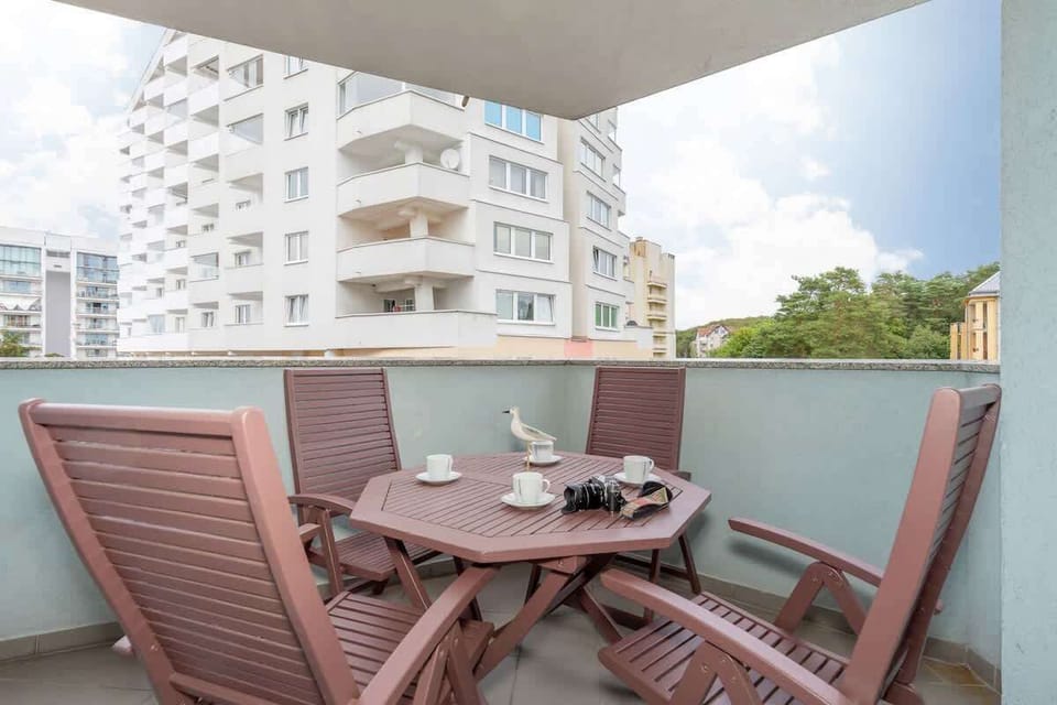 Balcony with garden furniture.
