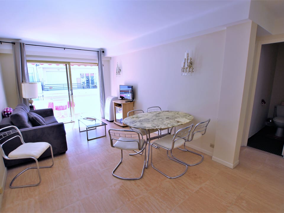 air conditioned living room, dining table, opening onto the terrace
