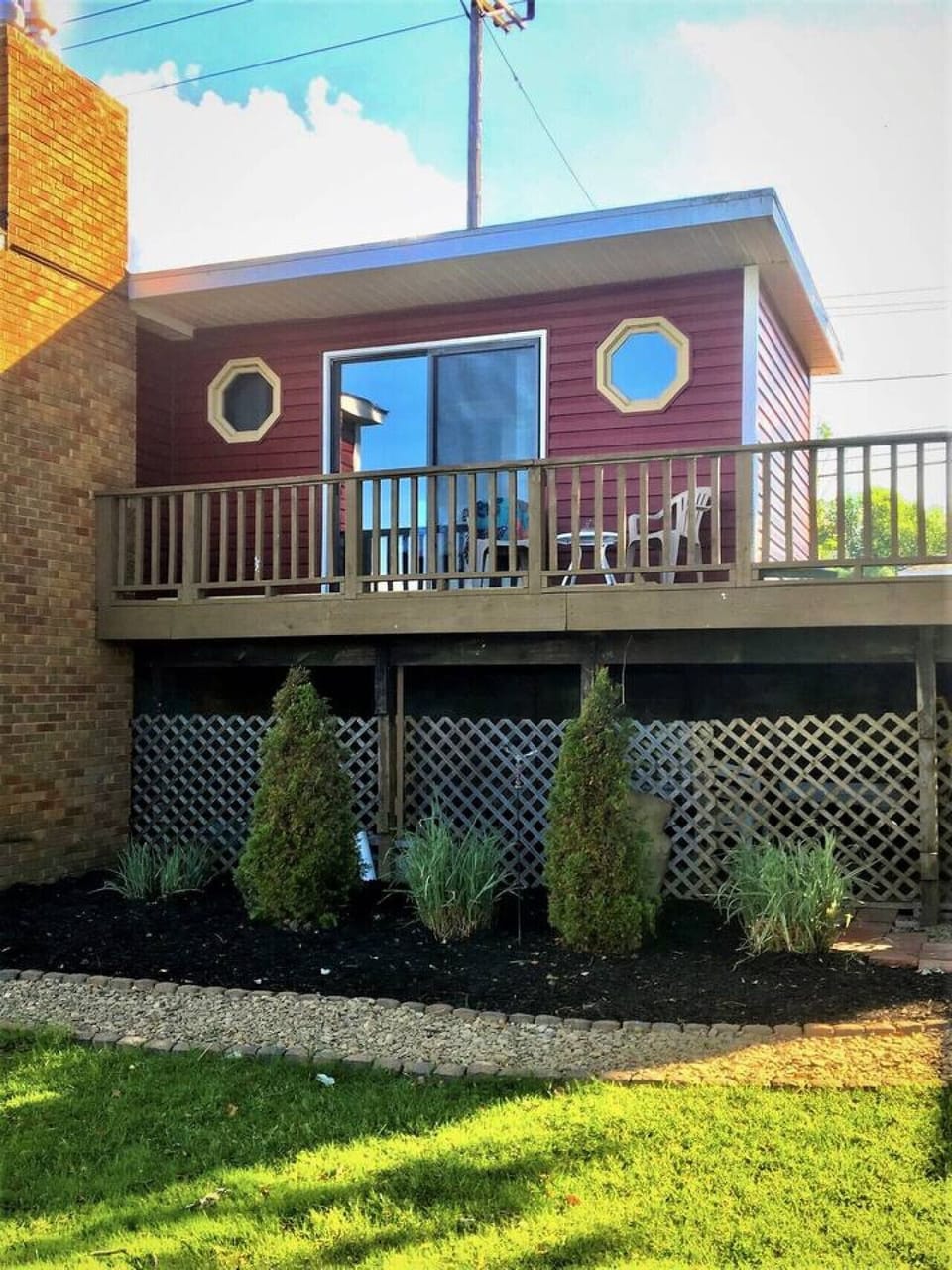 The  balcony with lake view, 2 chairs and a table to enjoy the morning coffee or an evening drink or a good book.