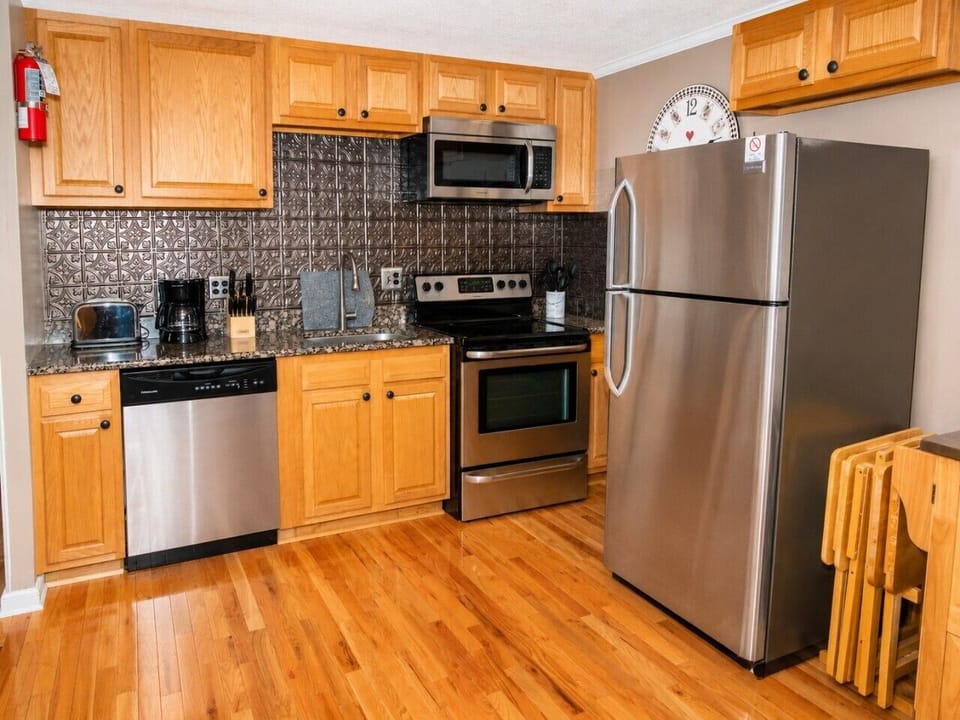 Remodeled kitchen is fully-equipped with pots, pans & utensils.