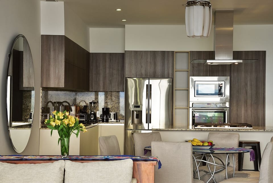 Modern kitchen with stainless steel appliances and granite countertops