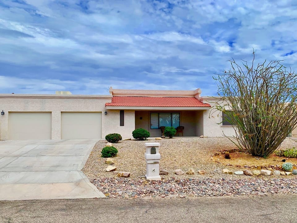Front of House (2 car garage plus outside gated Boat/RV Parking)