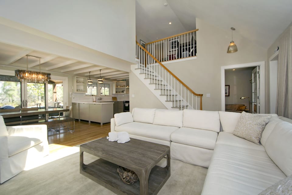 View of Downstairs. Pool is in view from glass sliding doors