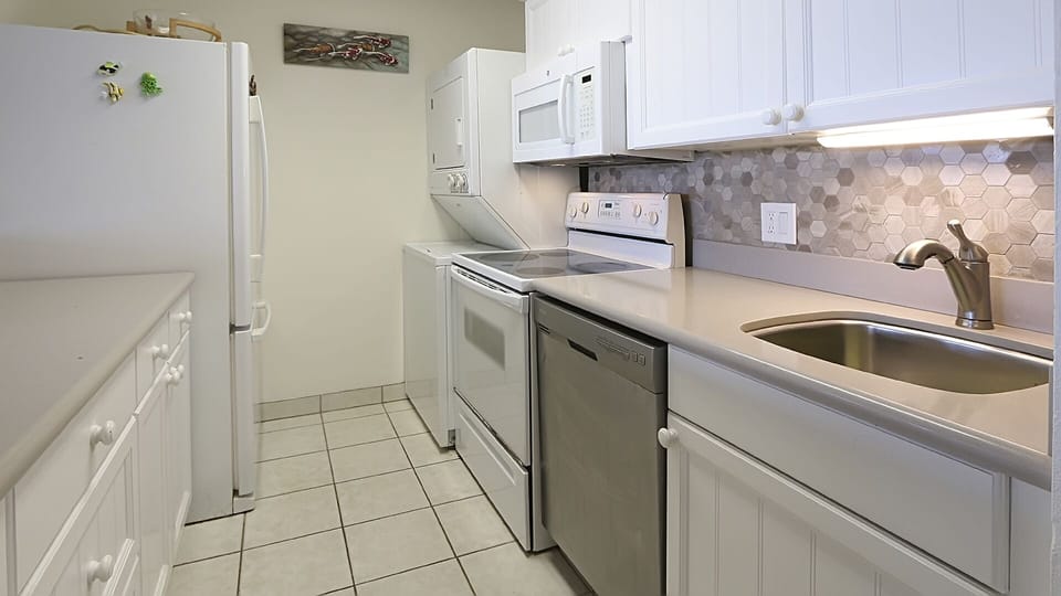 Kitchen featuring new quartz counter tops and under mount sink.