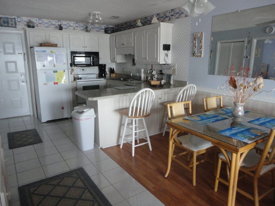 Full view of kitchen and dining table