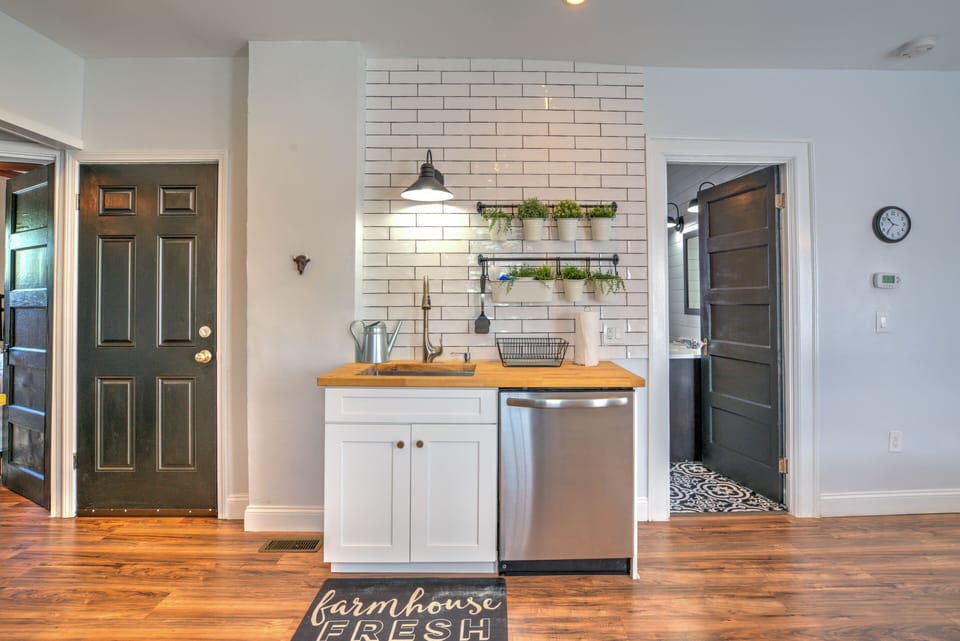 Lower Unit Kitchen, door on left leads to basement with large washer / dryer
