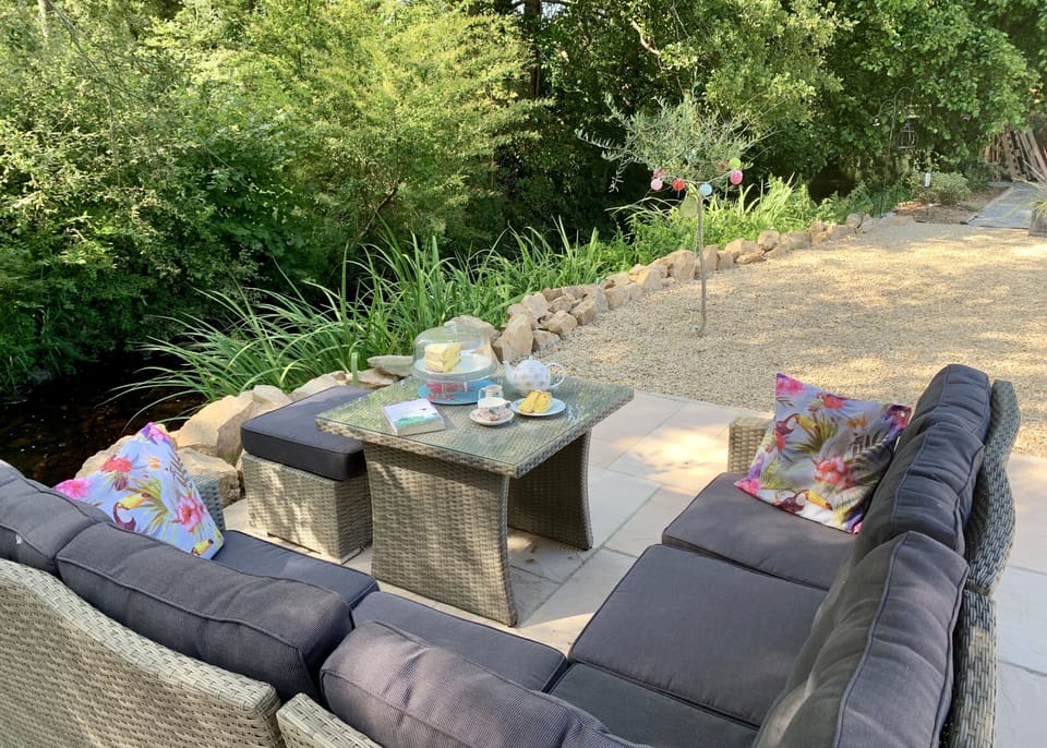 Relax in the shade alongside the river with a book  or glass of wine.