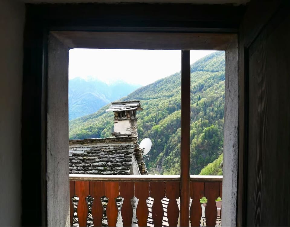 Bedroom 1 - View through balcony doors with wonderful mountain views
