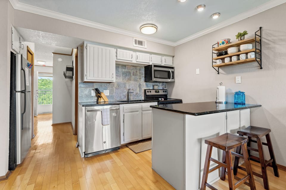 Additional seating at the extended cabinet and counter.