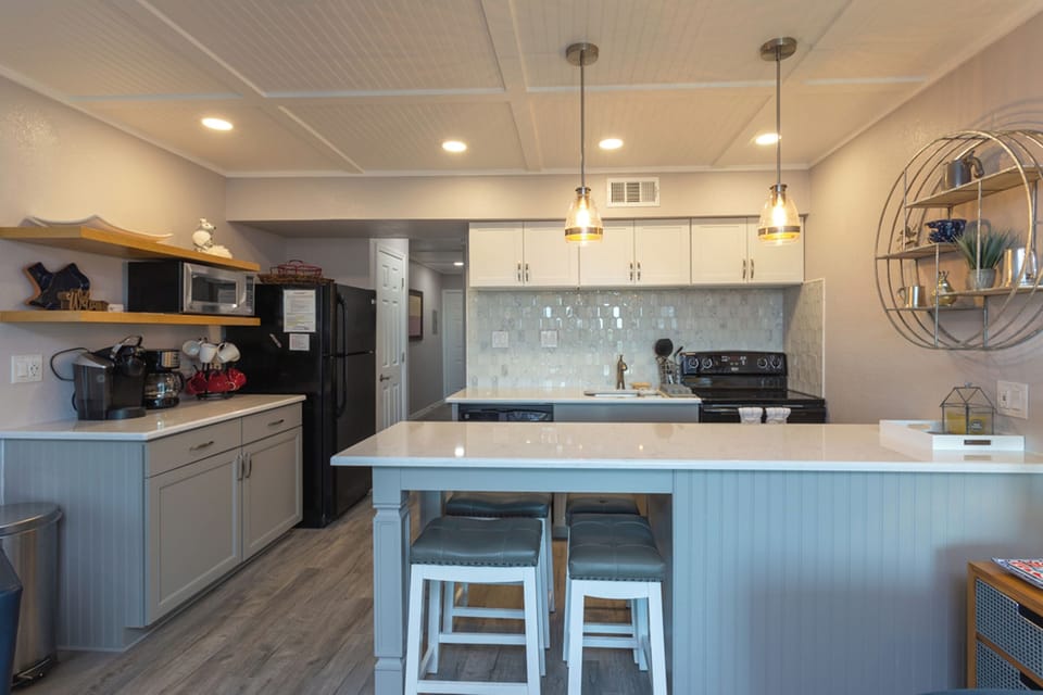 Updated kitchen with lots of counter space for meal prep.