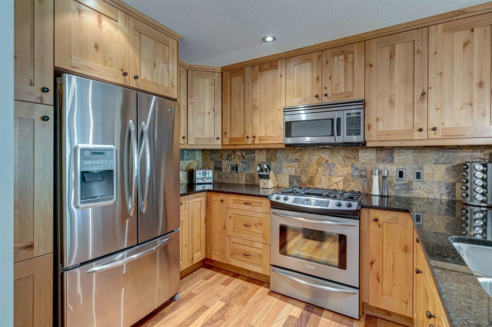 Alder wood kitchen cabinets - lots of storage