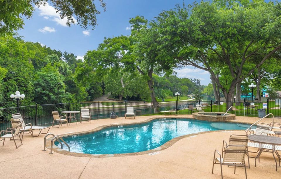 Pool area with view of the river and grounds.