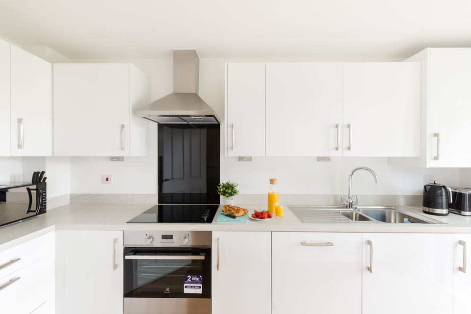 Kitchen with modern appliances. Everything you need for preparing meals.