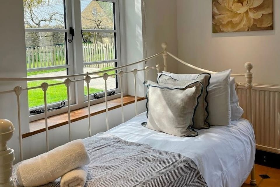 Ensuite bedroom on the ground floor. It has a double a single bed.