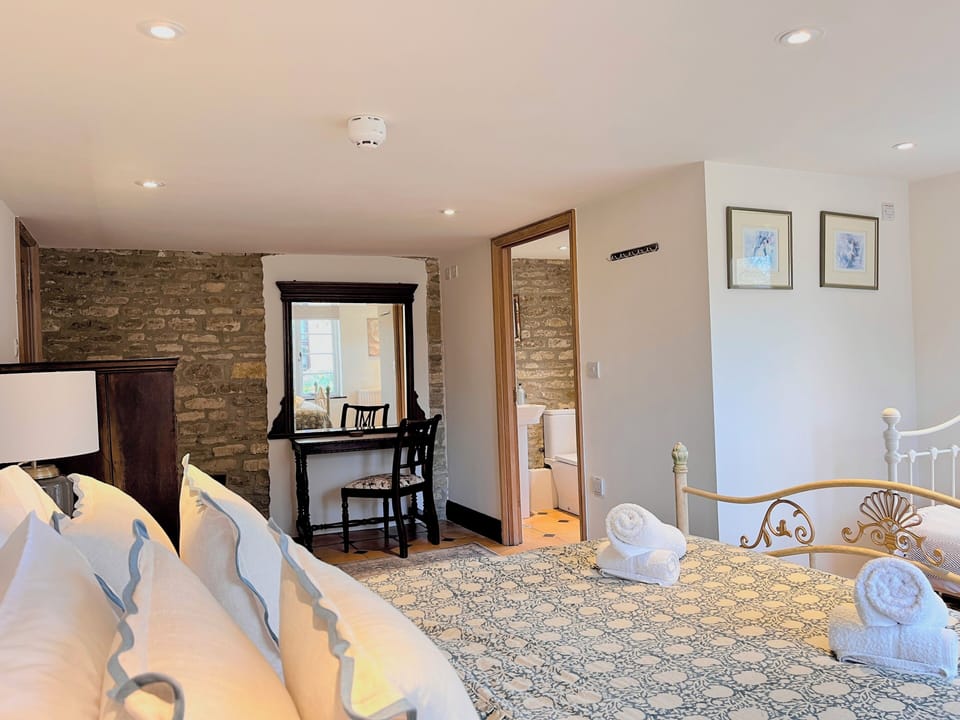 Ensuite bedroom on the ground floor. It has a double a single bed.