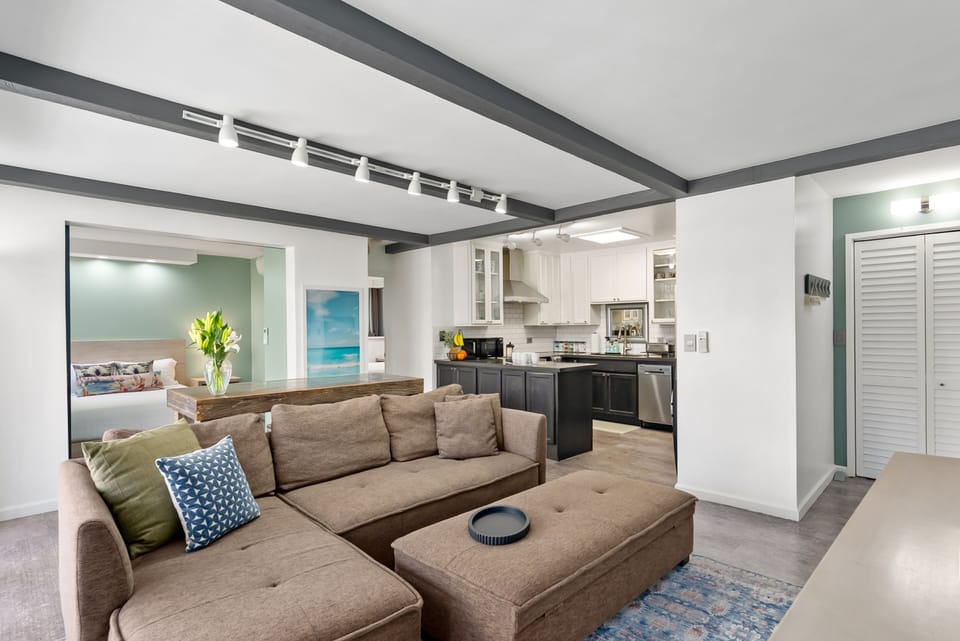 Fully-equipped kitchen with stainless appliances & generous counter space.