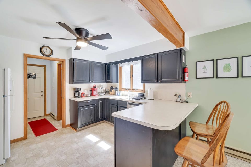 The kitchen with peninsula breakfast bar.