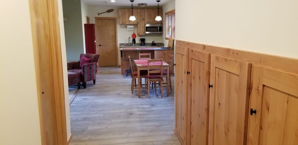 View from entry area, showing extensive entry cabinets for storage.