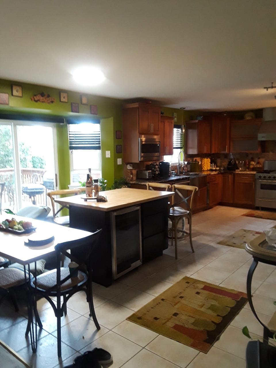 Island in kitchen has 4 bar height chairs  table has 4 chairs