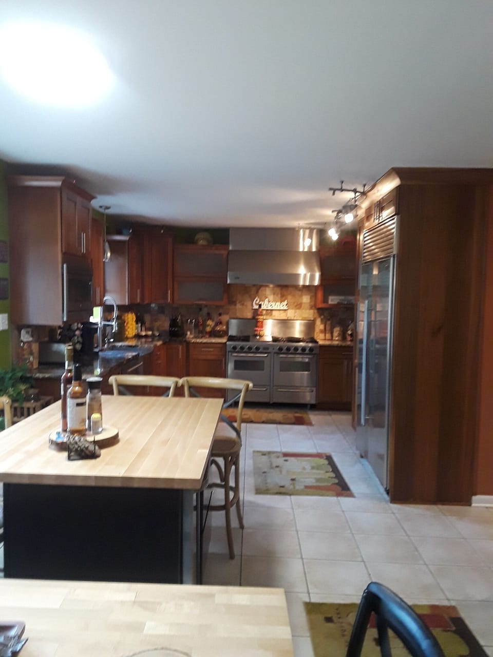 Chef's kitchen large prep area,  stove has 6 burners a grill and a double oven 