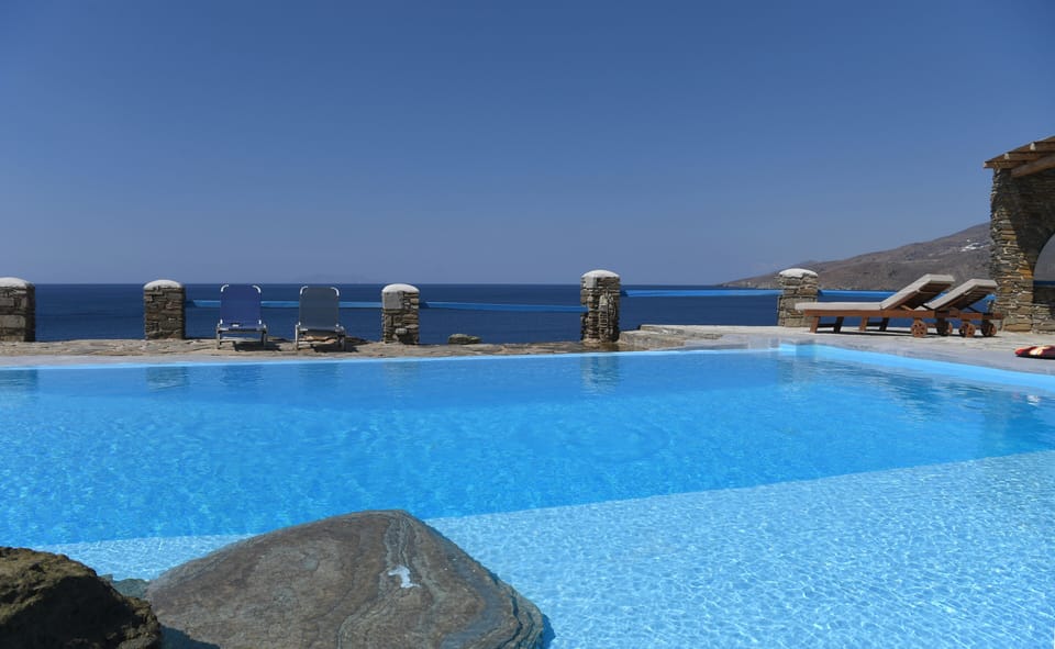 Relax by the pool overlooking the Aegean 