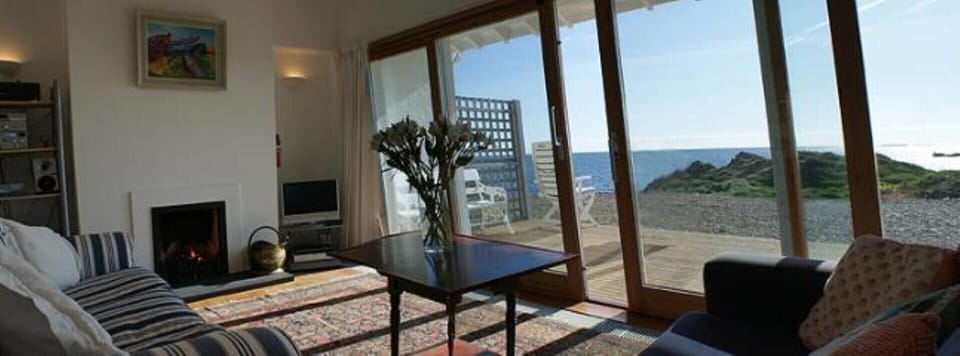 Sea is 50 feet from the deck of the cottage. Relax and enjoy
