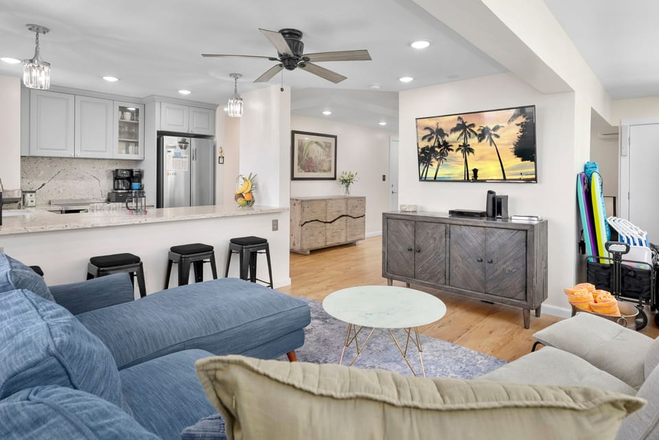 Open-plan living with Smart TV, beach gear & breakfast bar seating for four.