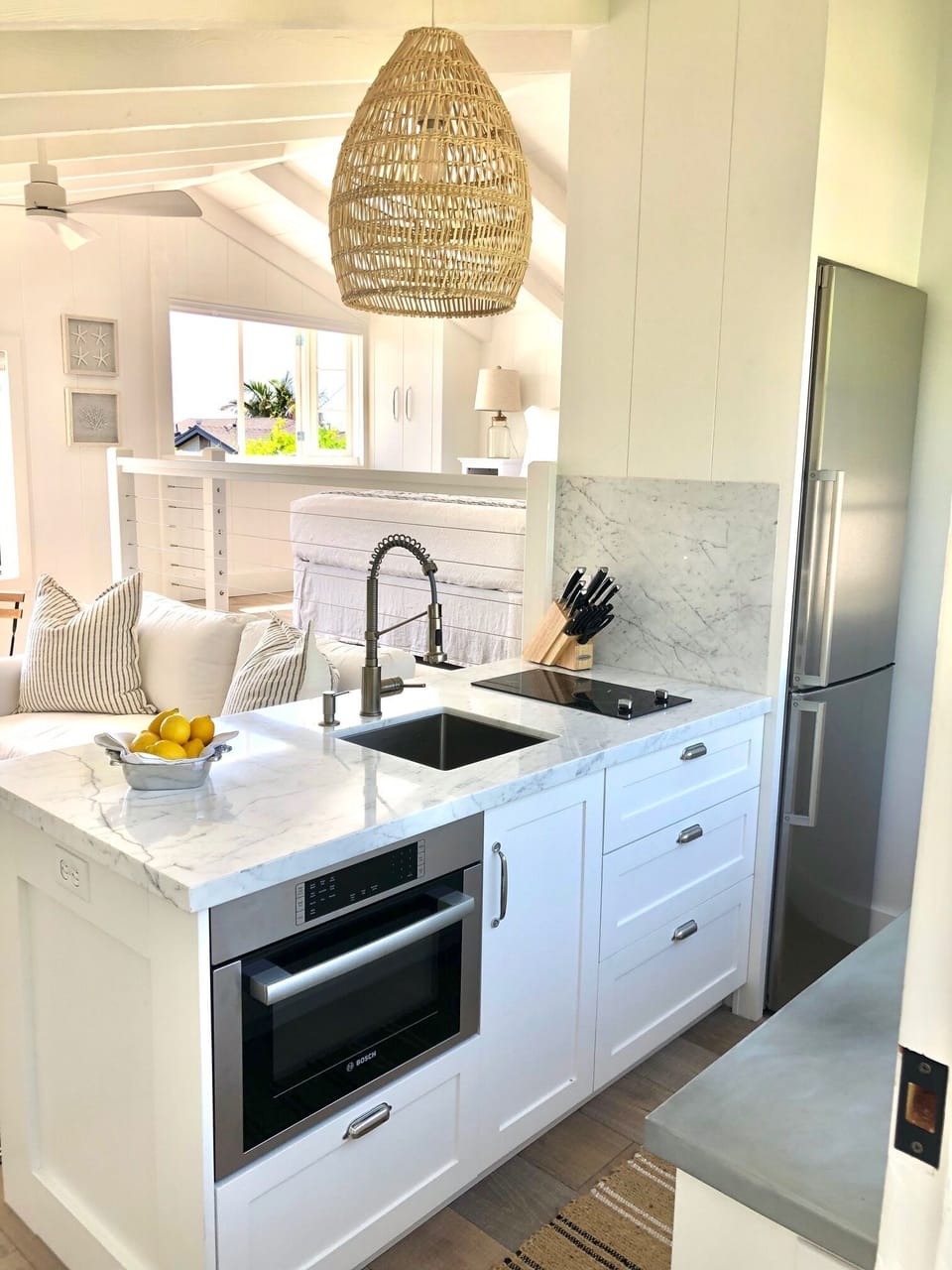 Fully stocked kitchen with Bosch appliances and marble countertop