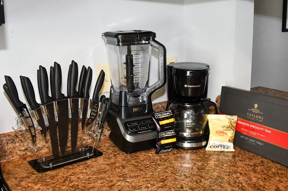 Kitchen includes coffee pot, Ninja blender, coffee, tea, & hot chocolate 