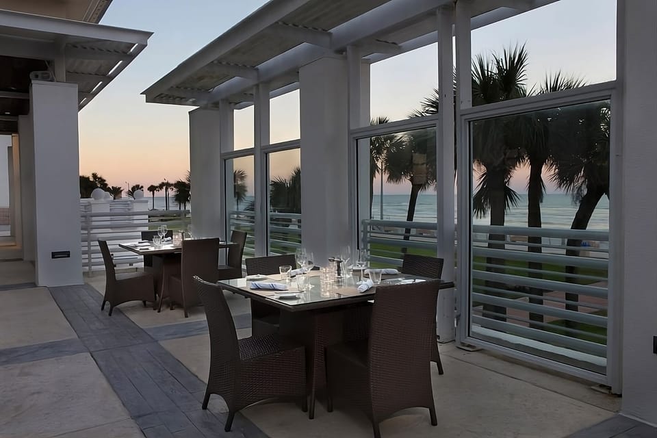 Sip sunset cocktails on the breezy oceanfront terrace dining.