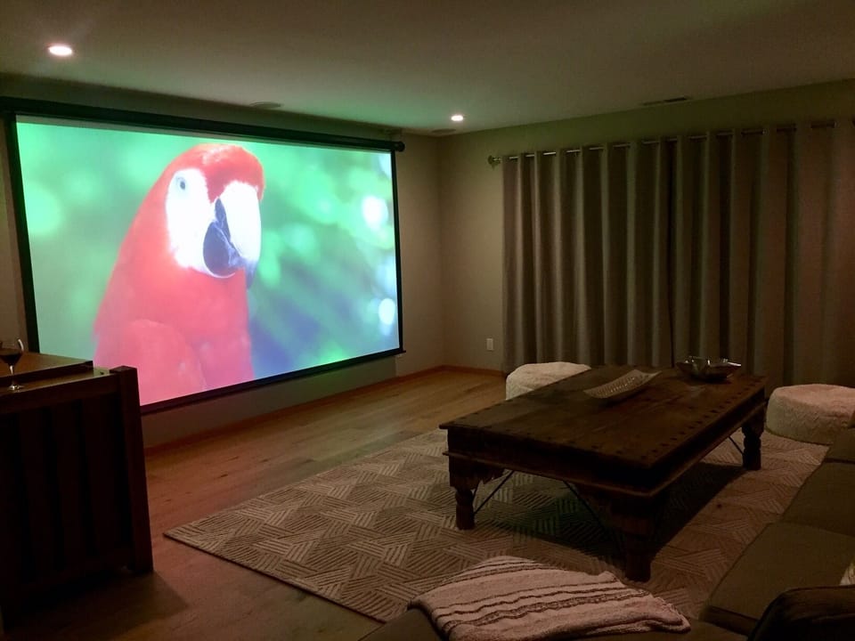 Relax at movie night featuring 150" remote control screen and projector