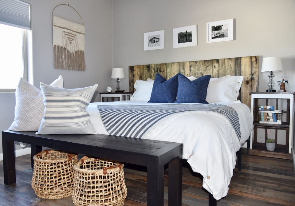 Bedroom on east side features a king size bed, two nightstands and wardrobe