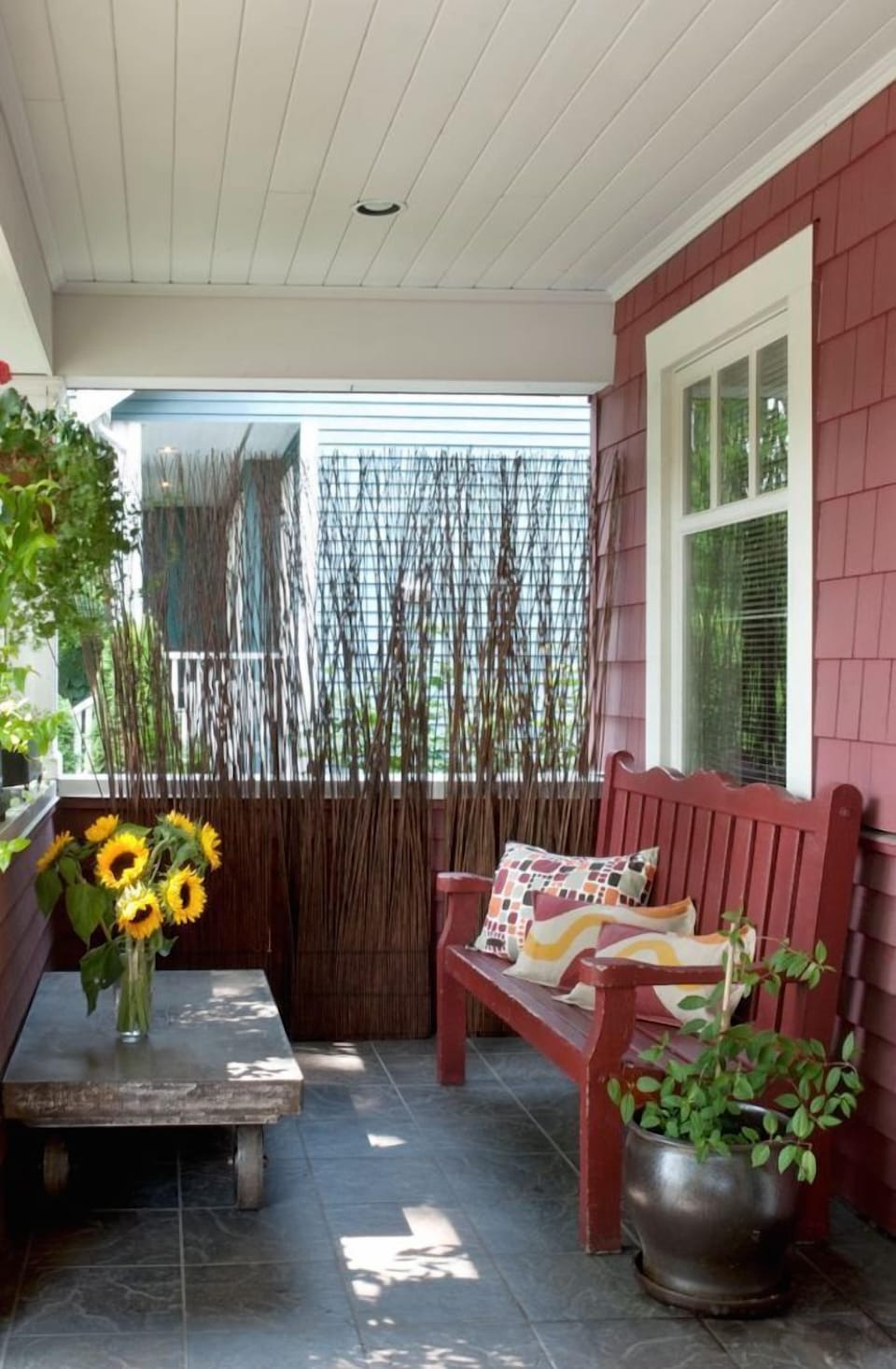 Front porch that faces beautiful tree-lined street