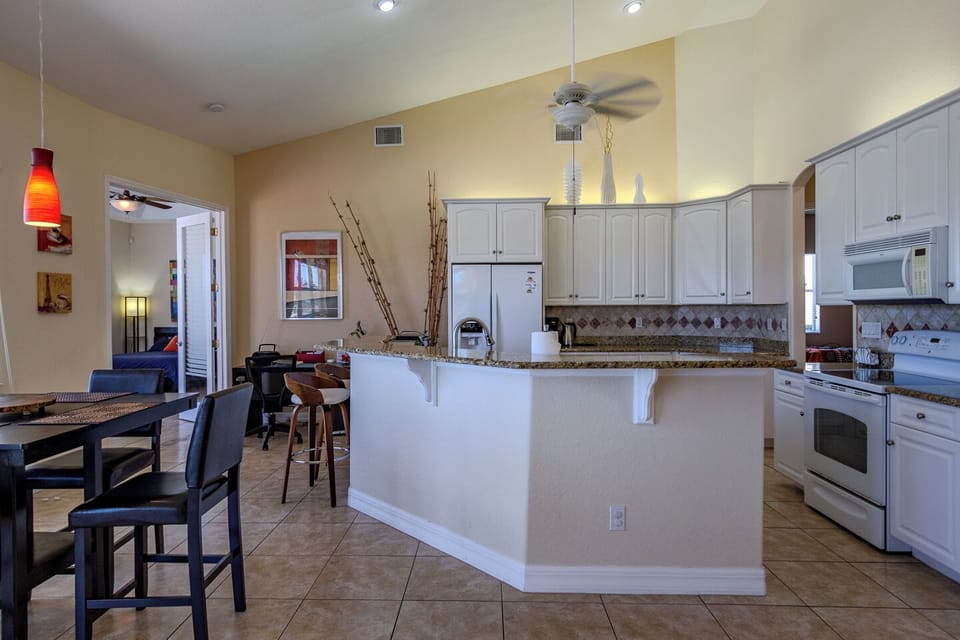 Kitchen and bar height breakfast table.
