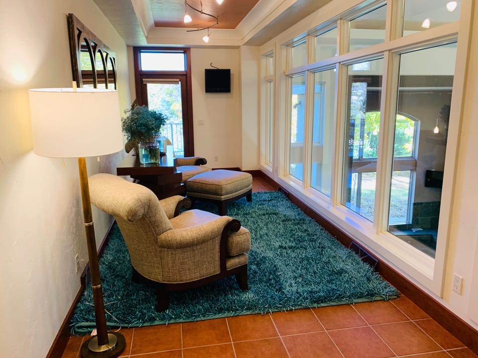 Family Room looking over the Pool Room. This room can convert to 4 single beds.