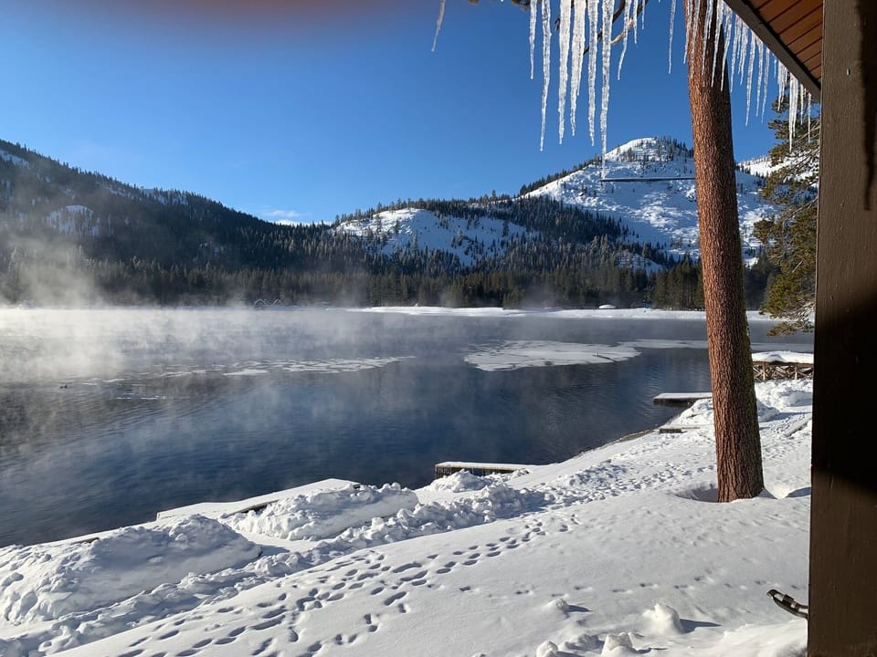 Morning in February.  
Partially frozen patches on the lake.   