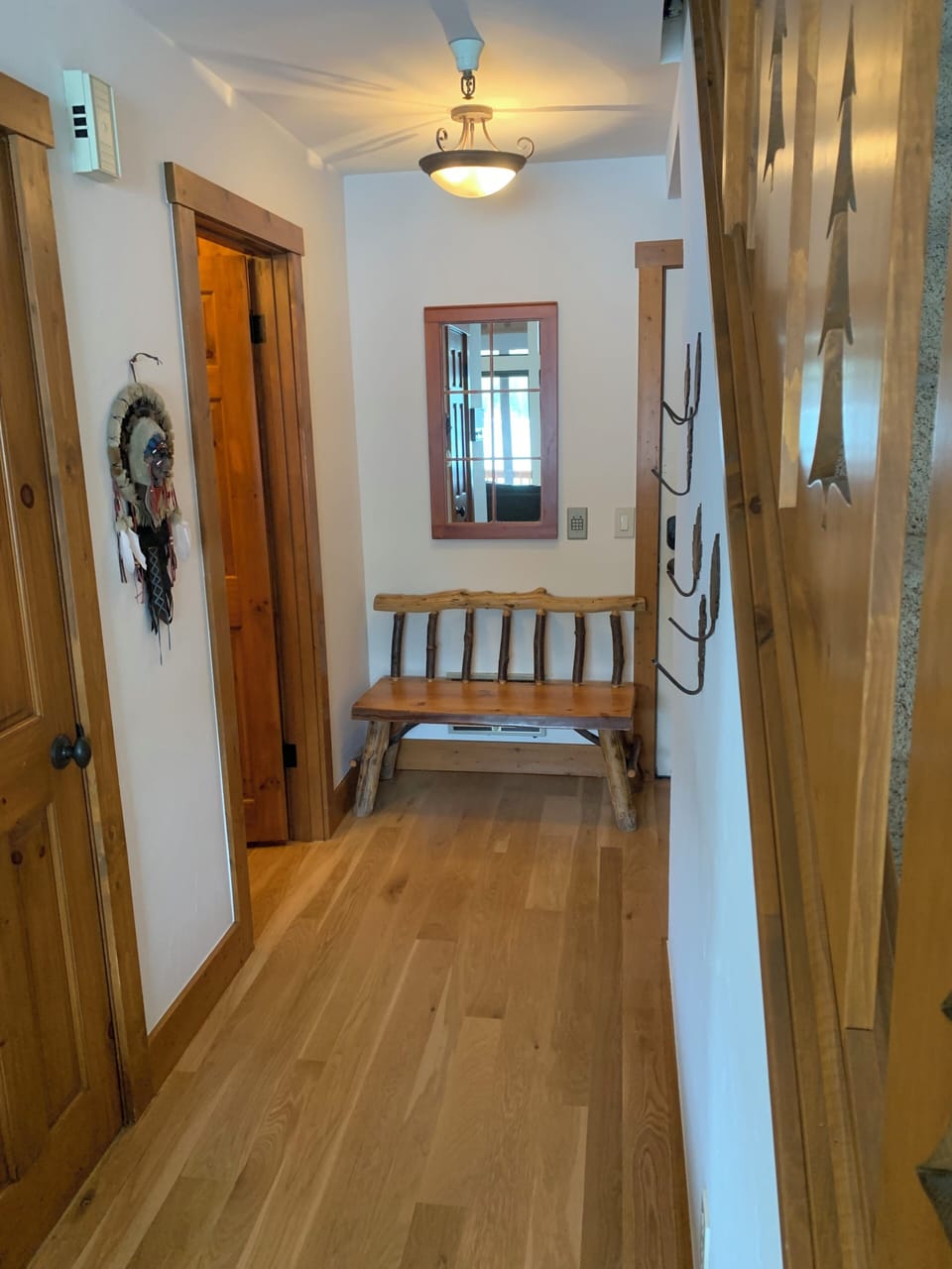 Half bath to the left and front door to the right.