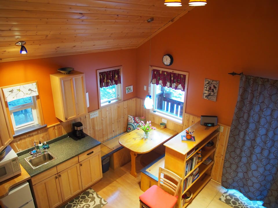 Bird's eye view from the loft of the kitchenette and breakfast nook