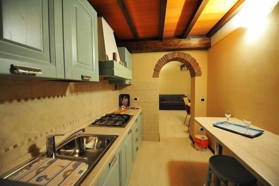 Panoramic of the kitchen with the sofa in the living room