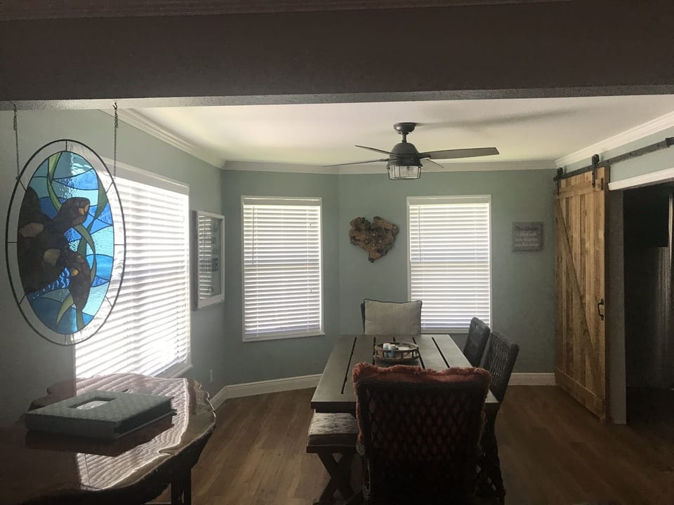 Dining room windows give u a beautiful view of the canal