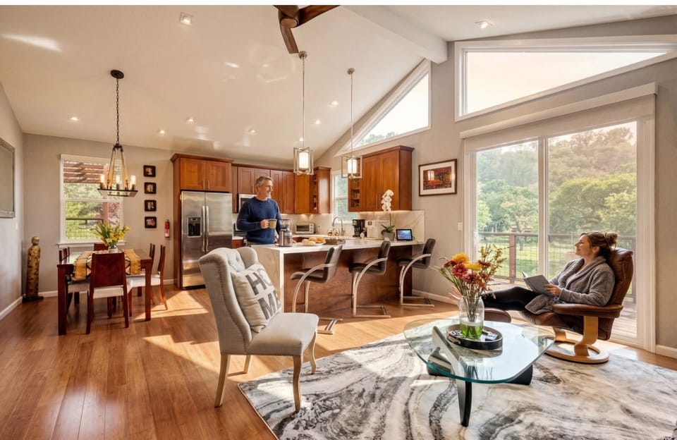 Vaulted ceilings and natural light from every angle — this is where your group ends up after dinner, with local wine and nowhere to be in the morning. We designed it for exactly that.