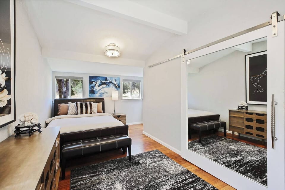 The second king bedroom opens directly onto the rear patio — so you can step outside with coffee in the morning without seeing anyone else in your group first. A very nice option to have.