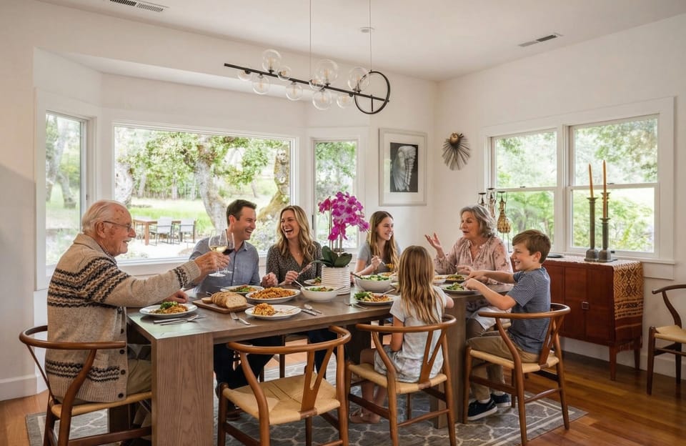 The dining table seats 8–10, faces the garden, and has seen some excellent meals and conversations. This is where the whole group actually ends up for the important moments.