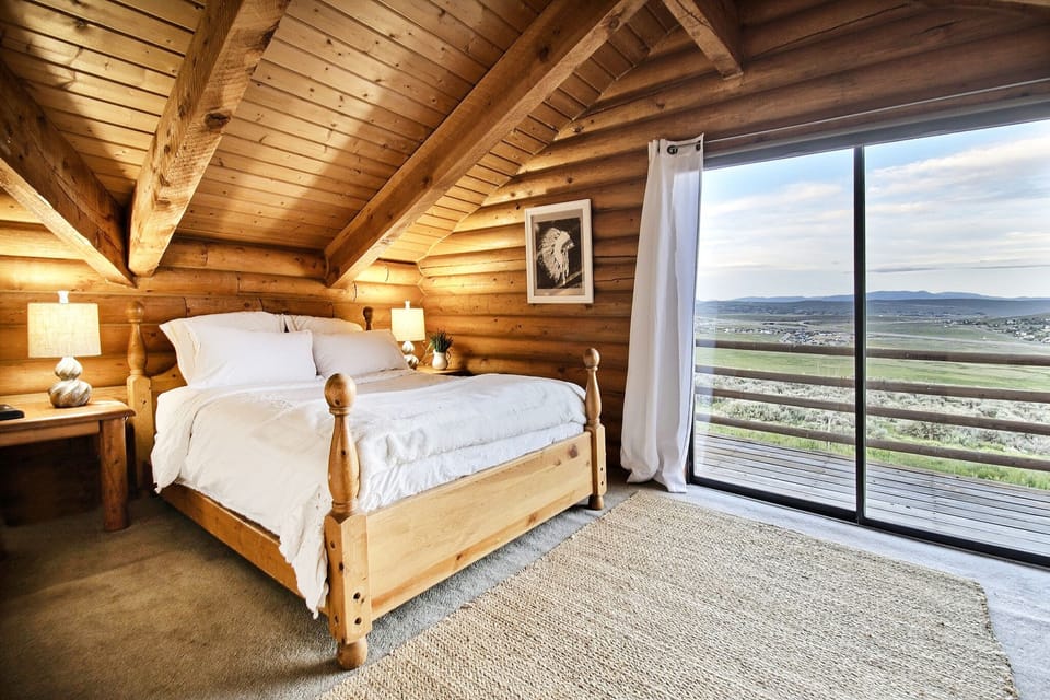 Second level guest room with full bed and luxury beddings.