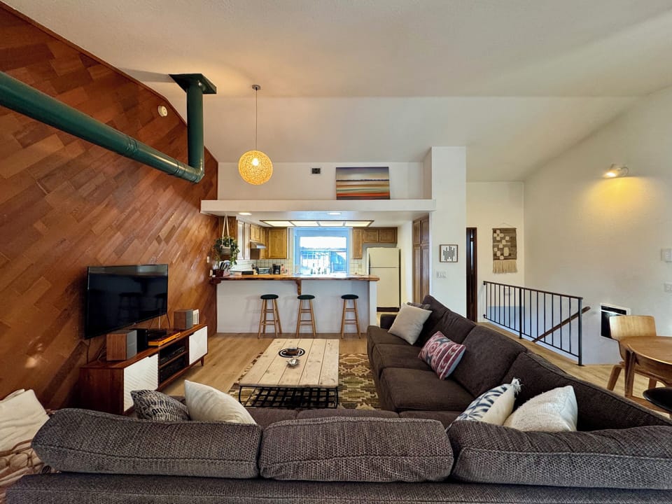 Living room open to dining area and kitchen.