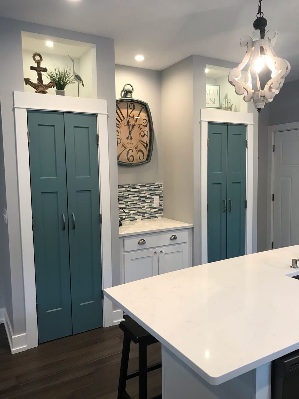 Pantry and closet doors in the kitchen.