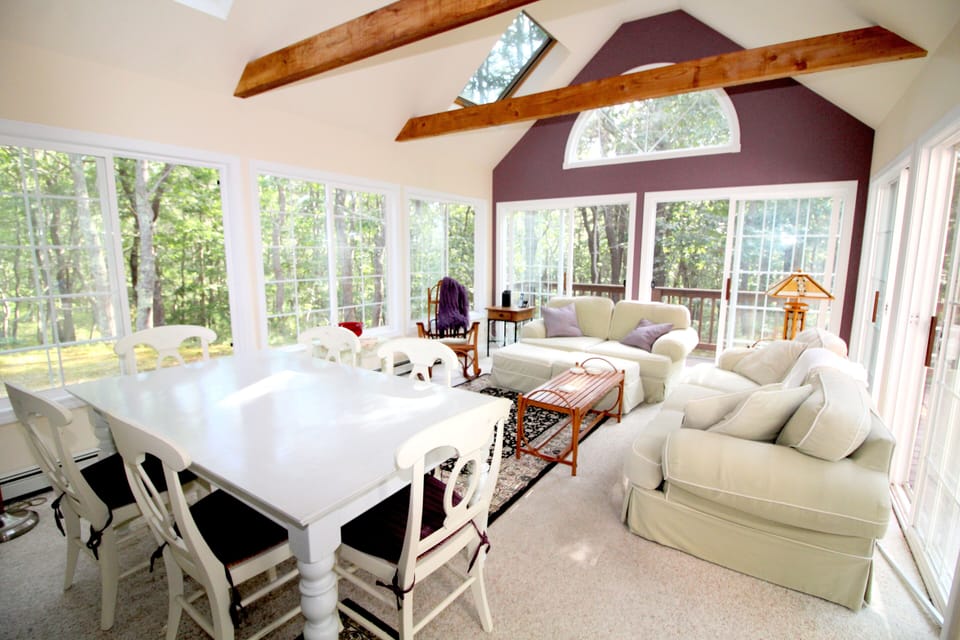 Sun room with sofa and chairs and table