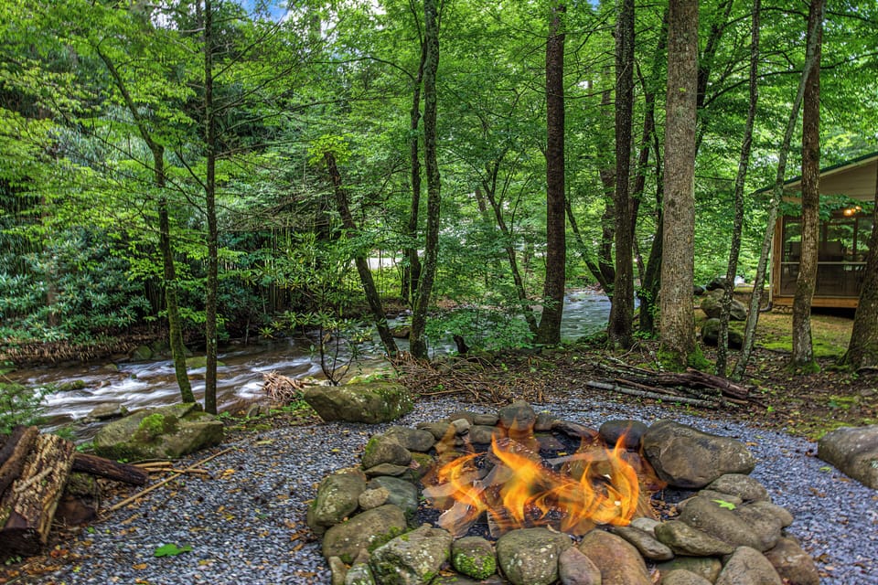Gather around the fire pit as the stream flows gently beside you, creating the perfect setting for peaceful evenings surrounded by nature's beauty.
